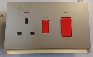 Tronic switched socket and cooker control unit