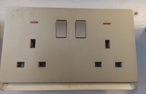 Double-gang switched socket outlet